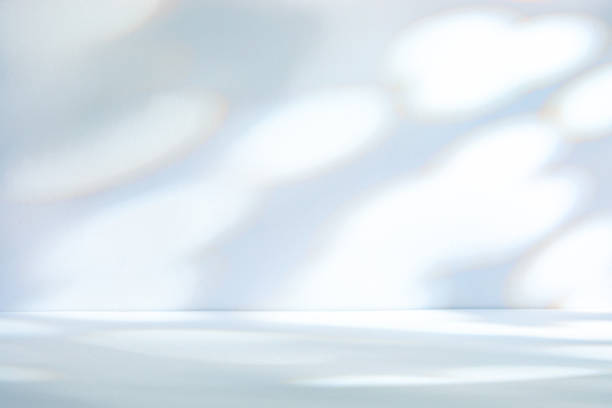 istock Light blue background with sunlight spots on wall and floor 2167662603