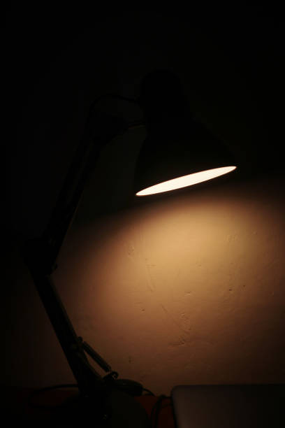 istock An orange light from a table lamp in the dark 2167662641