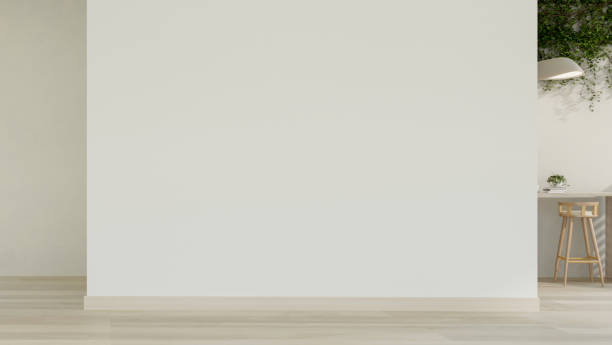 istock A contemporary, minimalist indoor hallway features an empty white wall and a parquet floor. 2167663599