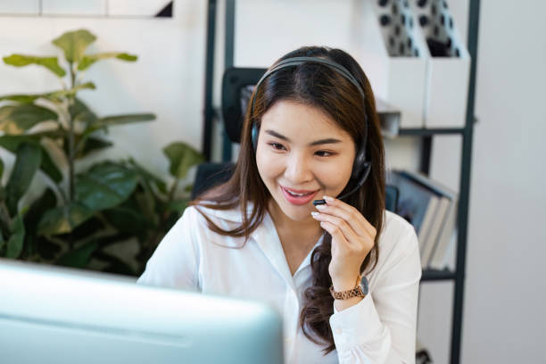 istock Smiling Call Center Agent with Headset Providing Customer Support in a Modern Office Environment 2167666961