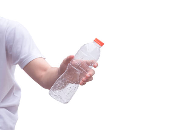 Young man hand holding empty plastic water bottle isolated on white background with clipping path