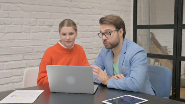 istock Business People Doing Video Chat on Laptop at Work 2167685665
