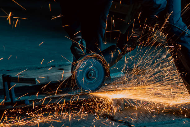 istock Orange sparks from cutting iron with circular saw 2167699678