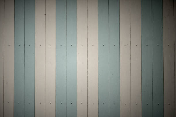 Yellow painted wood plank wall texture background.