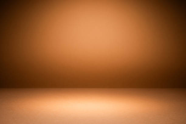 istock Orange brown background illuminated by soft lighting, creating a warm atmosphere suitable for display use 2167701306