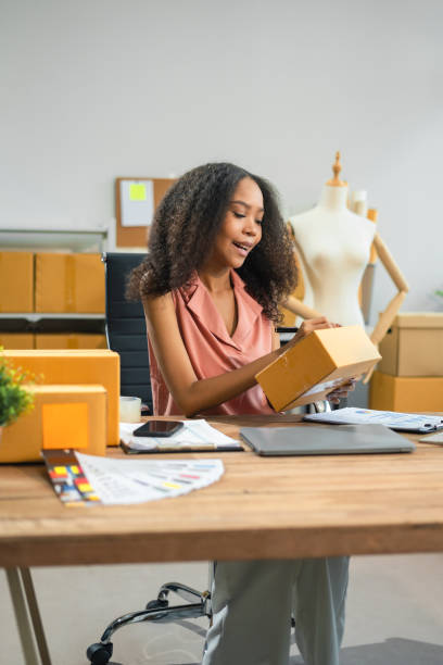 istock vlogger woman or designers, checking orders from customers, woman runs an e-commerce business on websites and social media. Concept of selling products online. 2167702003