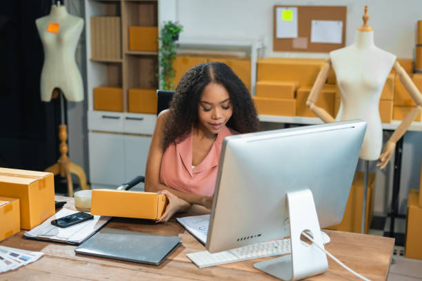 istock vlogger woman or designers, checking orders from customers, woman runs an e-commerce business on websites and social media. Concept of selling products online. 2167702004