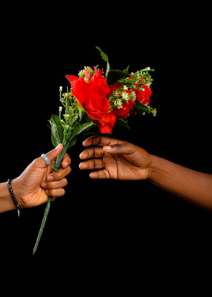 Hands holding a bunch of flowers