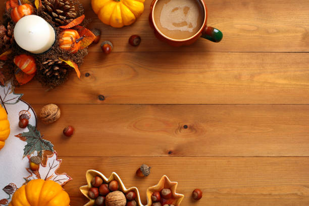 istock Autumn flat lay composition with fall decor, pumpkins, coffee cup, nuts on wooden background. 2167704331