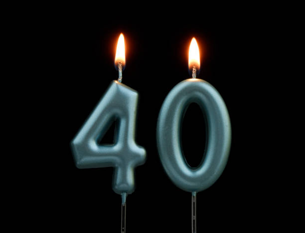 istock Blue birthday candles isolated on black background, number 40 2167707420