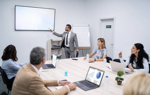 istock Presenter explaining during business meeting in boardroom. 2167709733