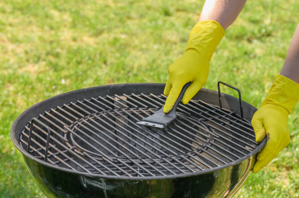 istock Clean the grill grate, metal grid with a wire brush 2167712248