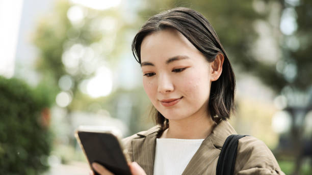 istock Woman holding a smartphone 2167713416