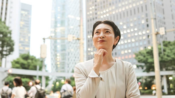 istock Successful mature woman looking up 2167713532