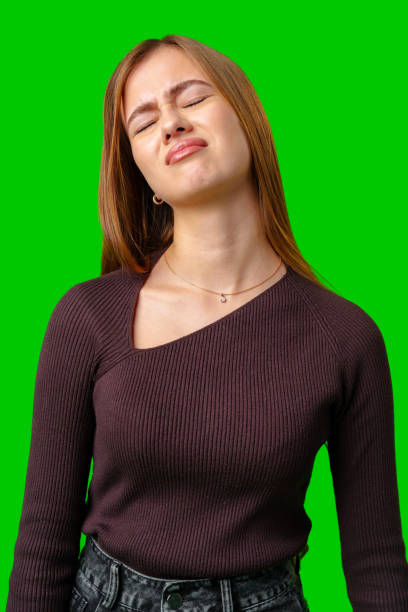istock Young Woman Wearing a Brown Sweater With a Disgruntled Expression 2167727083
