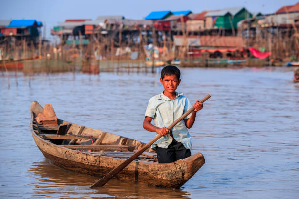 istock Cambodian young boy rowing a boat, Tonle Sap, Cambodia 2167727699