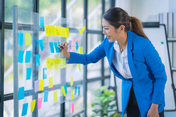istock Asian accountant doing accounting, payables, assets, book value, expenses, gross profit, diversification, liquidity with financial graph documents and laptop. 2167728282