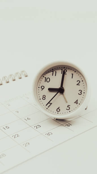 istock Clock and calendar on a white background. Business time management and schedule adjustment. 2167729753