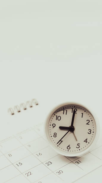 istock Clock and calendar on a white background. Business time management and schedule adjustment. 2167729754