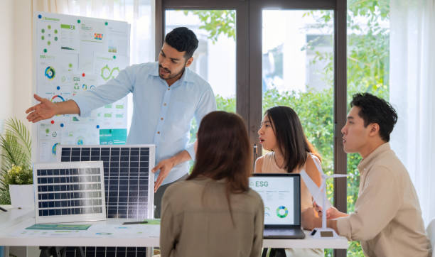 istock Diversity team presentation new design solar cell panel renewable energy innovation at office 2167730820