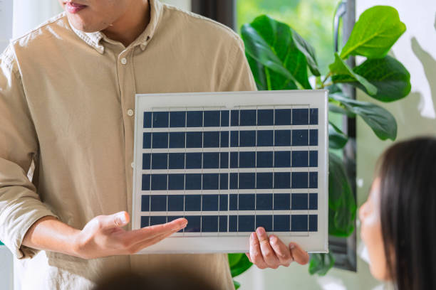 istock Diversity team presentation new design solar cell panel renewable energy innovation at office 2167731326