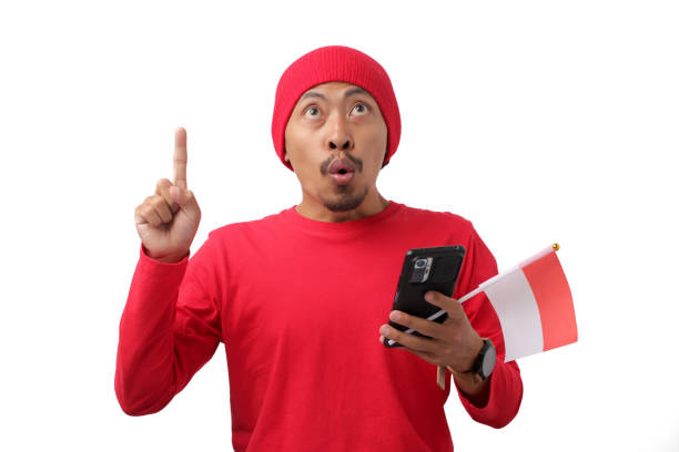 istock Indonesian Man Pointing at Empty Copy Space on Independence Day 2167732007