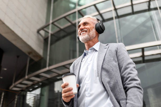 istock Businessman Enjoying Coffee Break with Headphones 2167735366