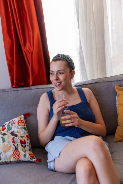 istock Beautiful women  drinking orange juice 2167737213