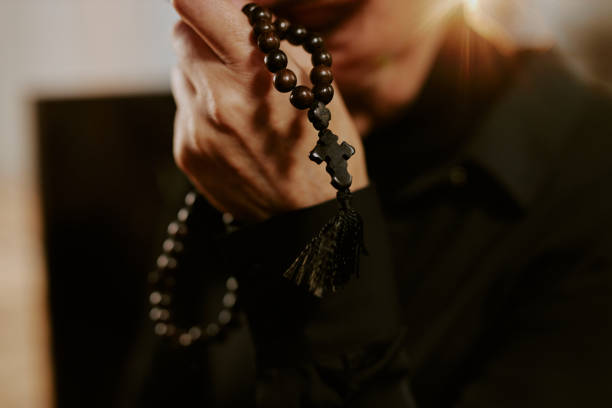 istock Wooden Rosary in Female Hands 2167738387