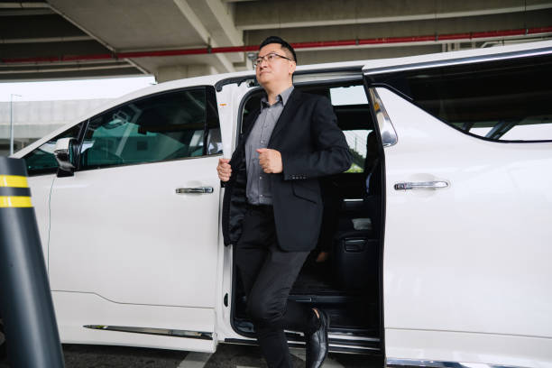 istock Businessman going out from car 2167740713