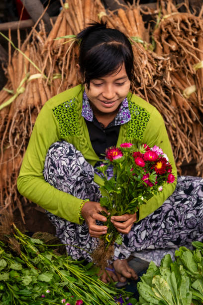 istock Burmese woman selling flowers, Myanmar 2167748708