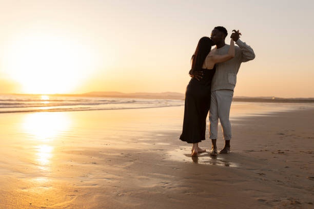 istock A couple is dancing on the beach at sunset 2167748965