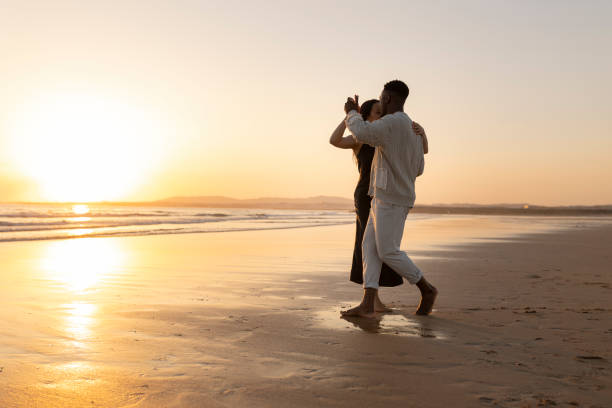 istock A couple is dancing on the beach at sunset 2167749155