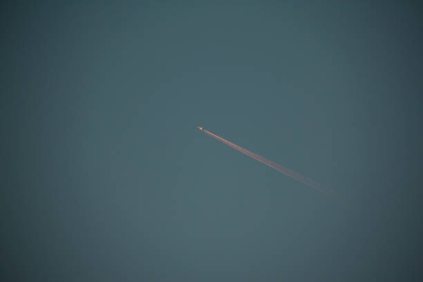 flight of airplane in the sky of shanghai city, china