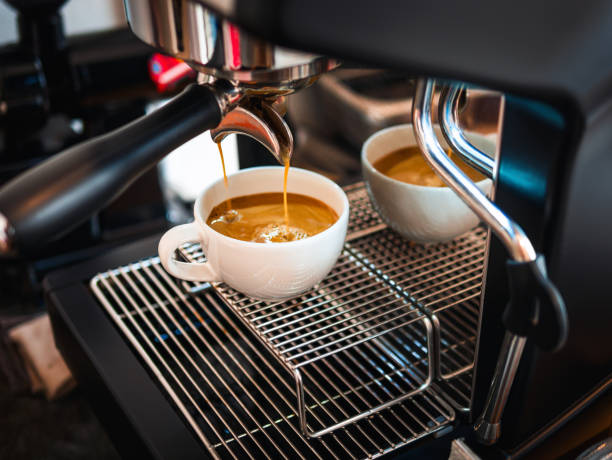 istock Professional espresso machine while preparing  espressos coffee cup in a coffee shop. Close-up of espresso pouring from the coffee machine 2167752468