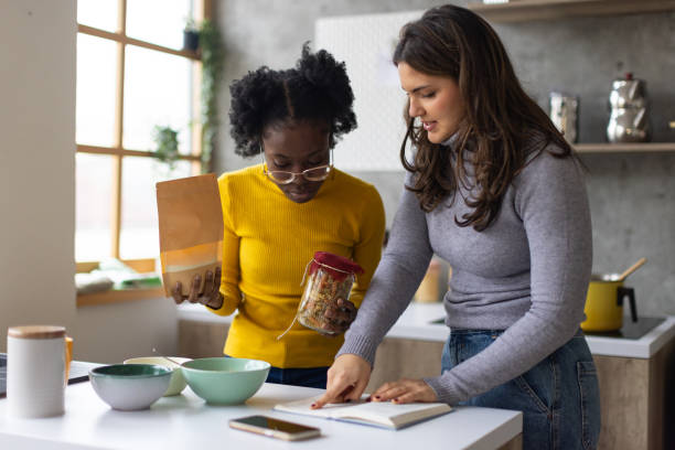 istock Two young women making breakfast together at home 2167752880