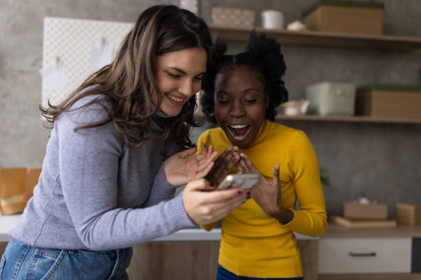 istock Two excited women using a smartphone 2167753049