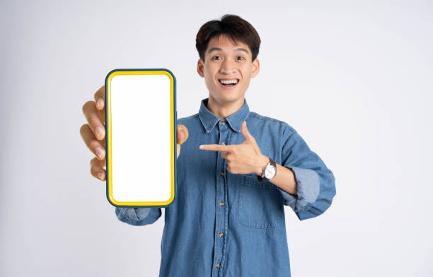 istock portrait of young Asian man using phone on white background 2167757480