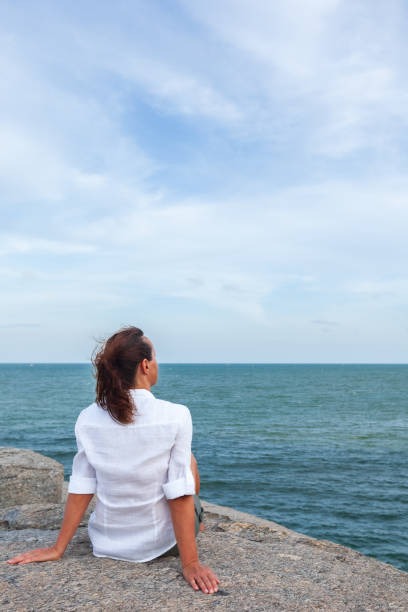 istock Mature woman on beach 2167758814