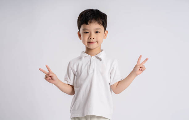 Portrait of asian boy posing on white background