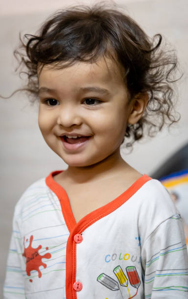 istock smiling kid innocent facial expression at indoor at night 2167760051
