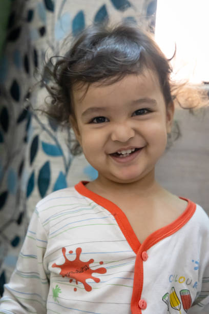 smiling kid innocent facial expression at indoor at night