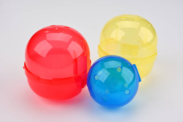 A group of colorful plastic bottles with wands for making bubbles out of soapy water waiting for preschool students to play with during recess.