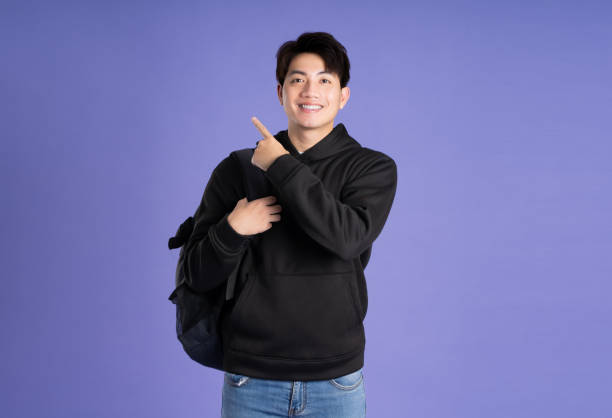 istock Asian male posing on purple background 2167769321