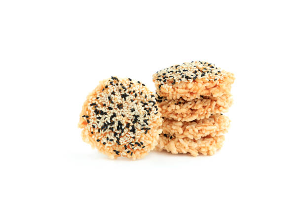 istock Rice cracker with sugar cream and white sesame and black sesame toppings isolated on white background, Homemade biscuits, Thai name is Khao Tan 2167771030
