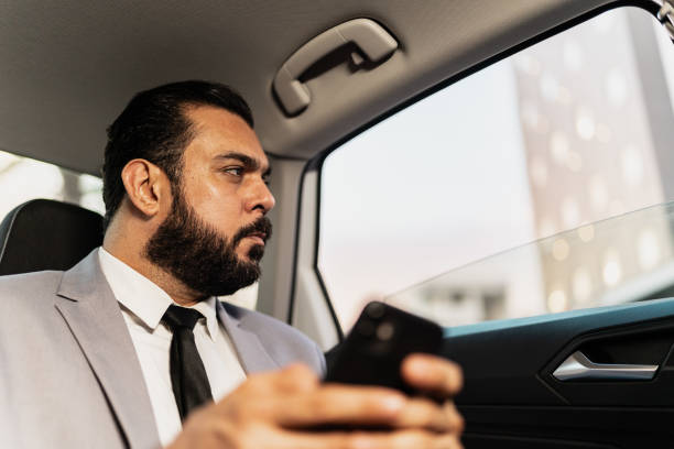 istock Businessman looking through window in a cab 2167771672