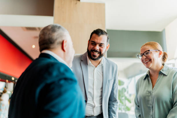 istock Coworkers talking in lobby at hotel 2167772025