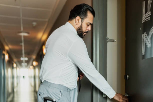 istock Businessman entering in a hotel room 2167772663