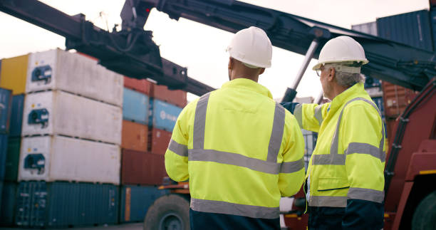 istock Men, back and logistics in container yard for inventory management, stock and supply chain or freight. Supervisor, inspection and quality control in industry, shipping in trade for commercial export 2167775904