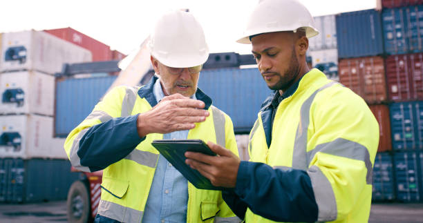 istock Cargo dock, people and tablet in logistics quality control or stock management with foreman. Engineer, tech and maintenance in freight, supply chain and industry for global shipping company 2167775922